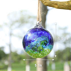VCUTEKA glass witch ball sparkles in sun, creating lively reflections on fences and lawns.