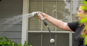 Vego Garden Hose Nozzle in action delivers high pressure spray for cleaning tasks.