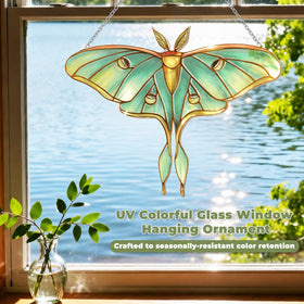 Velaboll green Luna Moth hanging in a sunlit window