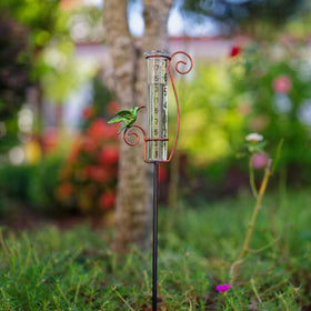Venniy rain gauge with metal stake stand in garden.
