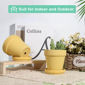 Vensovo yellow pot on balcony adds warm, decorative touch to patio.