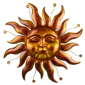 VESTCDF metal sun wall art 26-inch gold finish hangs in garden for outdoor ambiance.