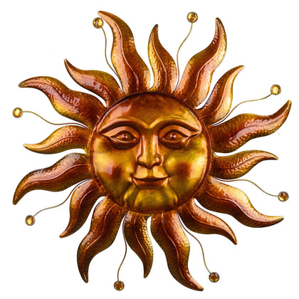 VESTCDF metal sun wall art 26-inch gold finish hangs in garden for outdoor ambiance.