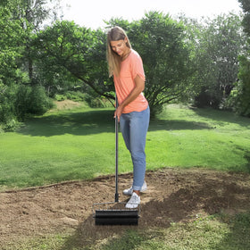 VEVOR aerator in action creates tiny holes that improve water and nutrient flow.