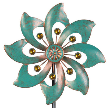 VEWOGARDEN single-blade wind spinner with floral design adds visual motion to a garden.