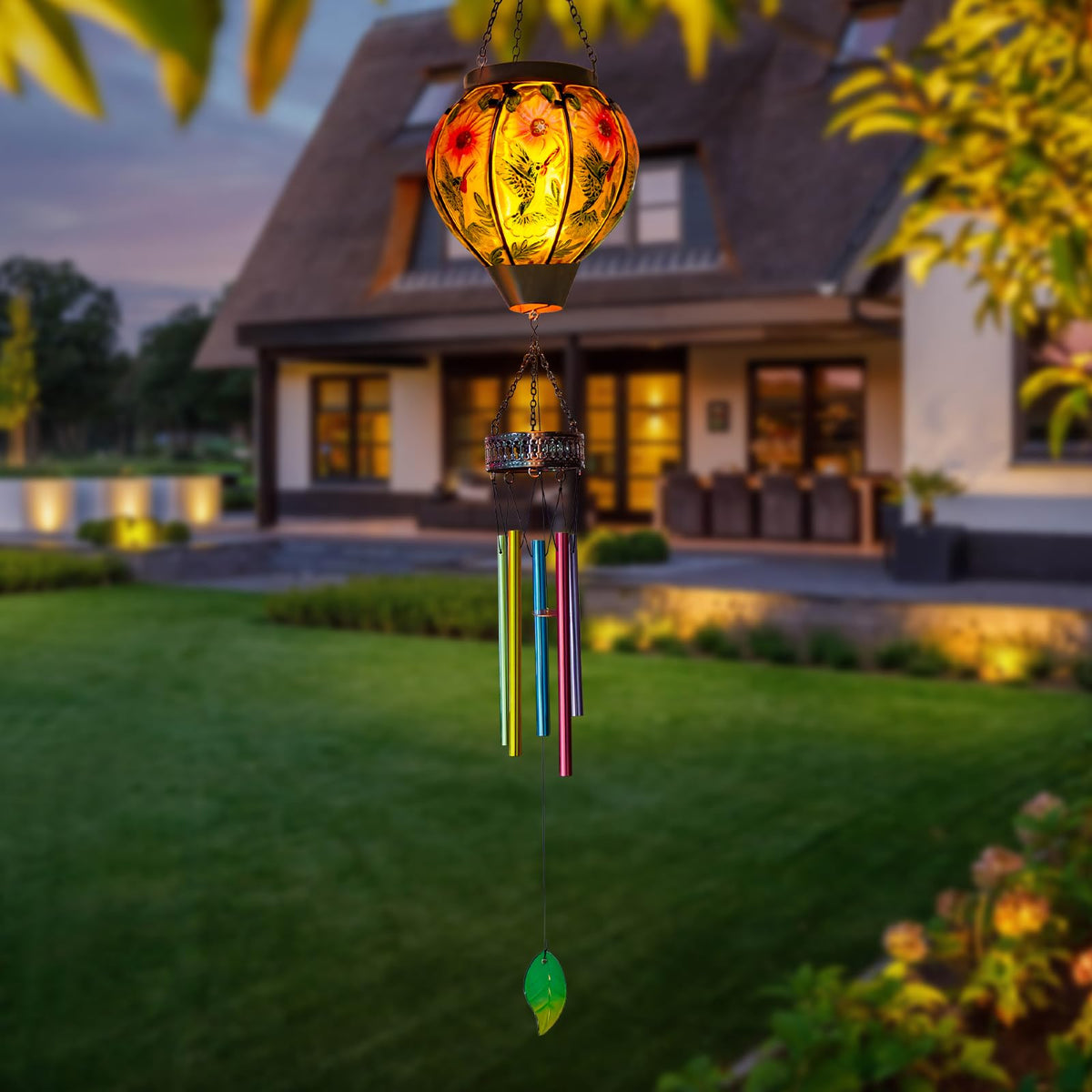 VEWOSTAR outdoor decor with hummingbird motif and lantern glow.