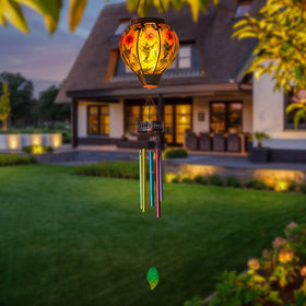 VEWOSTAR outdoor decor with hummingbird motif and lantern glow.