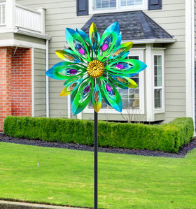 Dual-layer wind spinner rotates smoothly in light wind showing blue, green, and yellow hues.