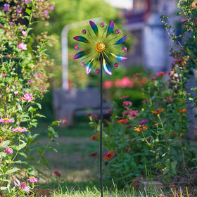 VEWOSTAR wind spinner reflecting light as it spins outdoors