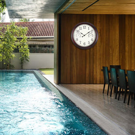 Vigorwise clock on patio wall enhances garden decor and timekeeping.