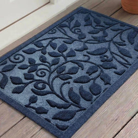 VivaNest blue leaves ivy scroll doormat at the front door, welcoming guests with style