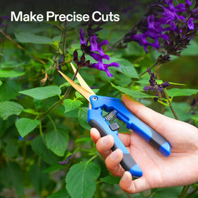Spring-loaded pruning snips reducing grip fatigue for extended garden work