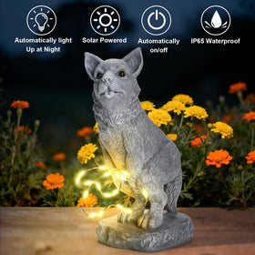 VOFSTAND waterproof resin dog statue stands up to weather.