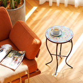 Vonluce end table with drinks and books for everyday use.