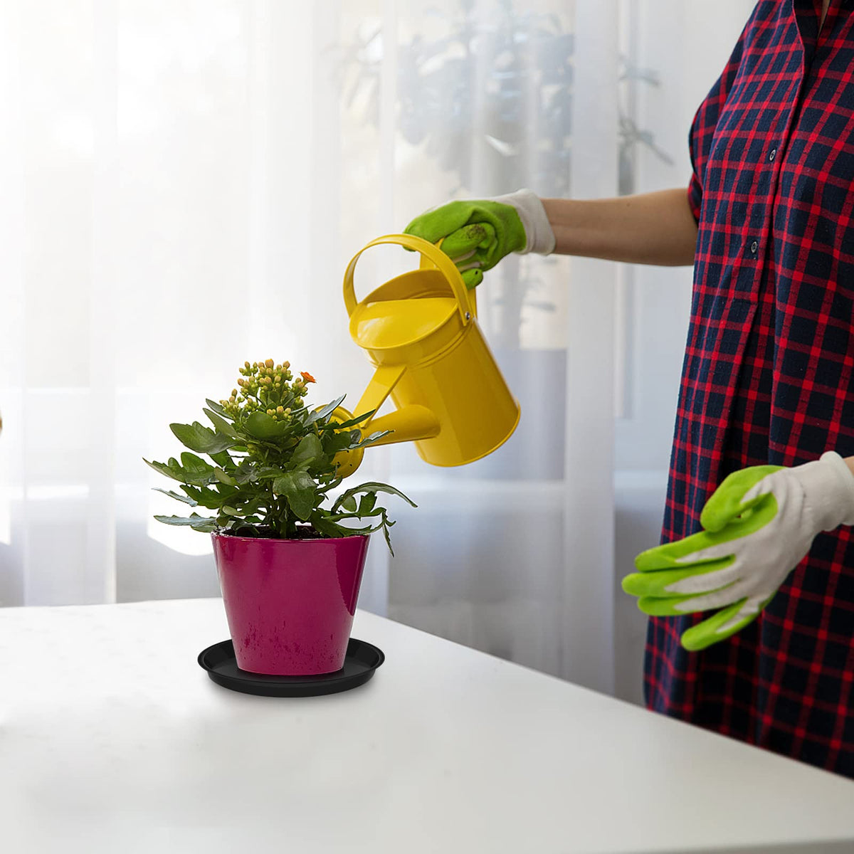 VUWEZ indoor-outdoor plant saucer fits under pots in any setting.