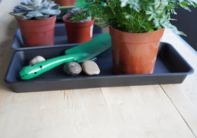 Water drainage tray under flower pots preventing floor moisture with VUWEZ.