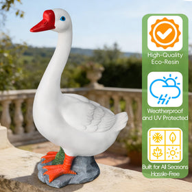 VYRALACH goose statue with a red beak adds vibrant color to pathways.