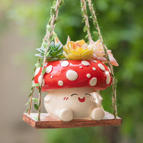 Walasis mushroom planter with 3.9-inch opening shown with small succulents