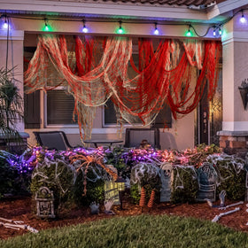 Watayo yard entrance gauze decor sets a chilling scene for outdoor displays.