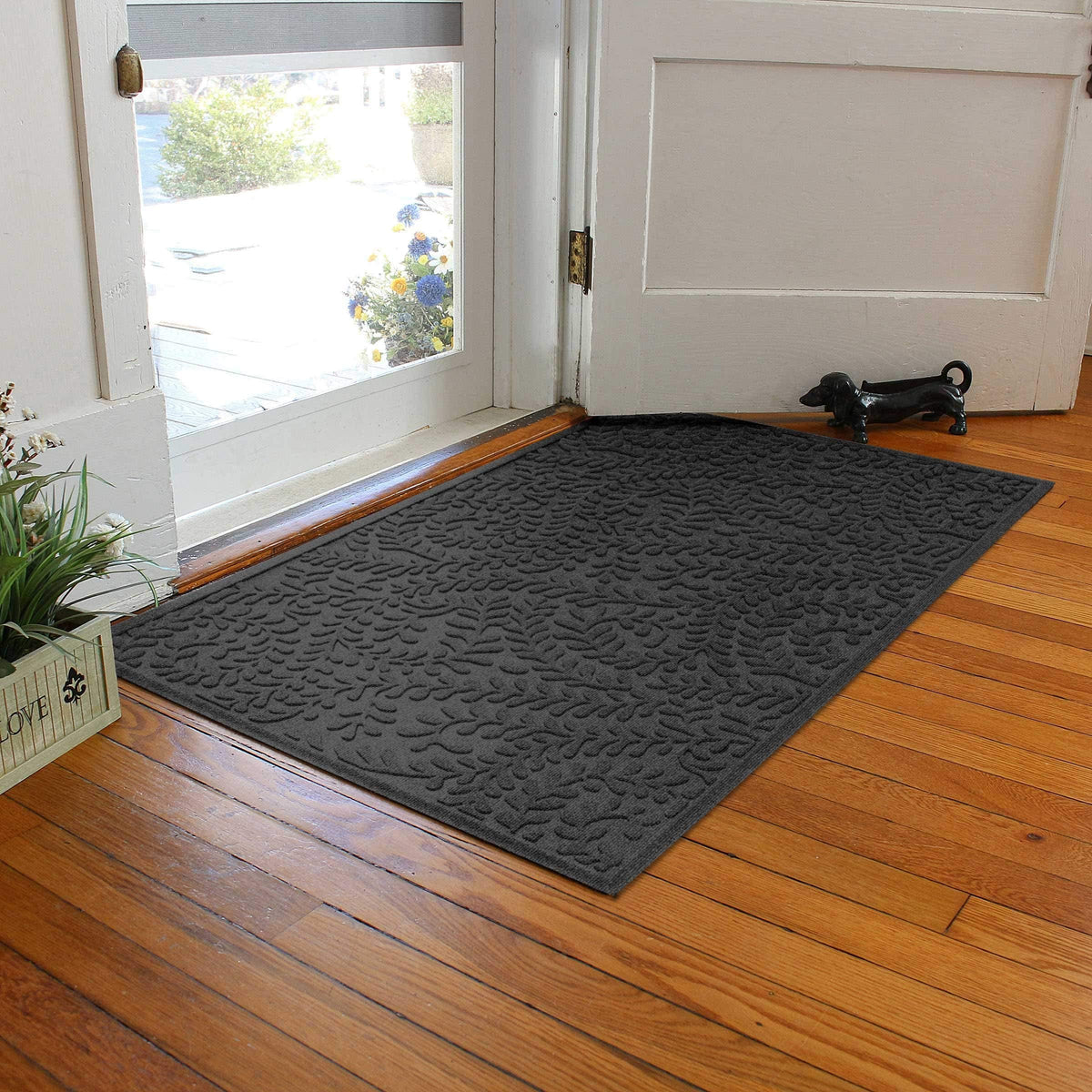 WaterHog Boxwood ridged floral water-trap design captures moisture to protect floors.