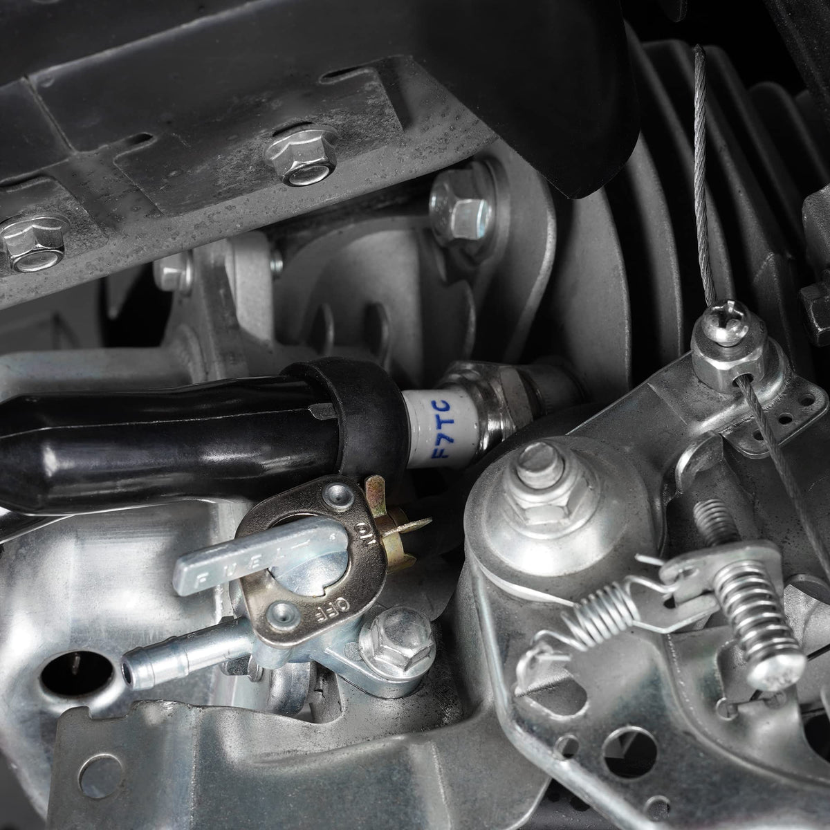 Watoday spark plug durability visual emphasizes long-lasting performance.
