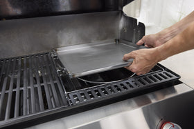Carbon-steel cooktop close-up, rust-resistant and pre-seasoned.