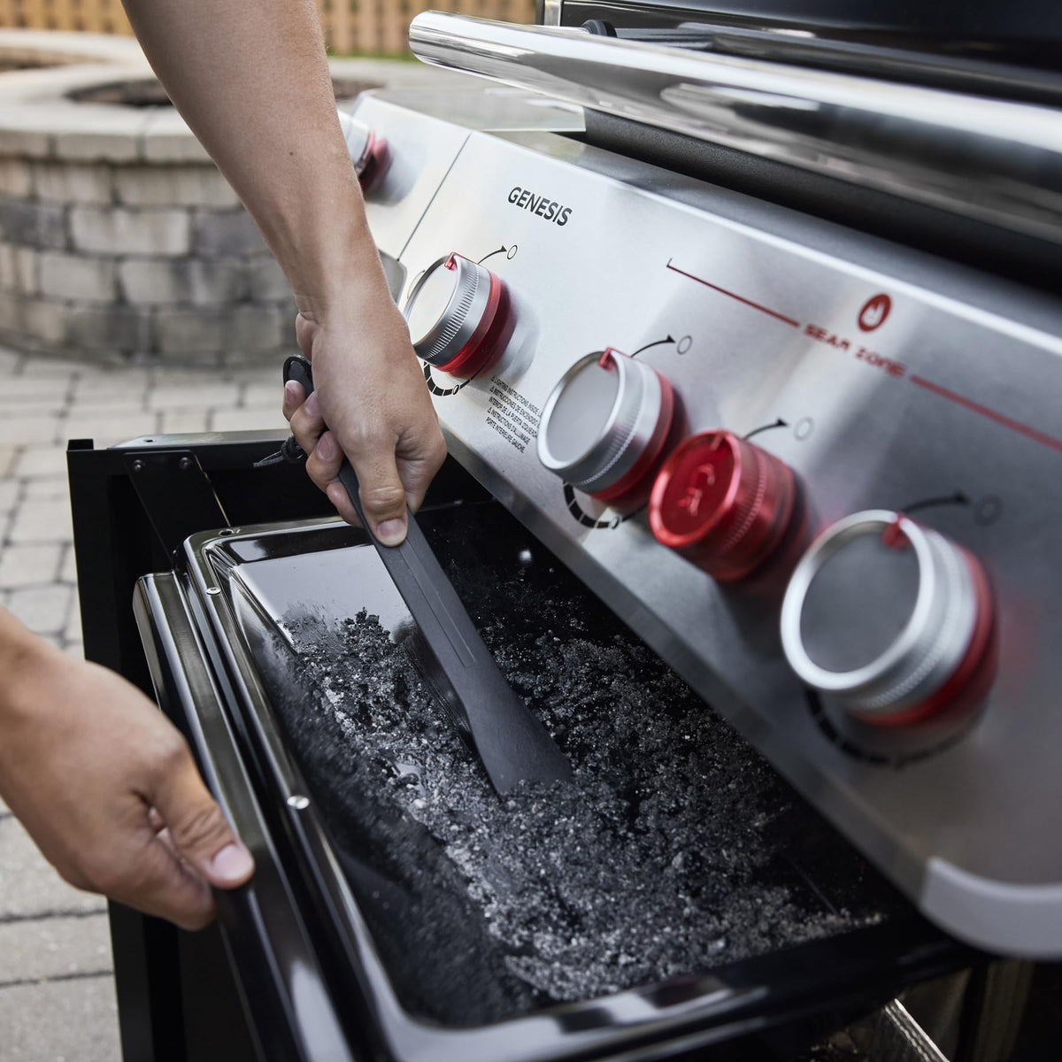 Grease-management tray slides out for quick, mess-free cleanup after cooking.