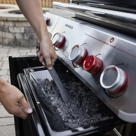 Grease-management tray slides out for quick, mess-free cleanup after cooking.