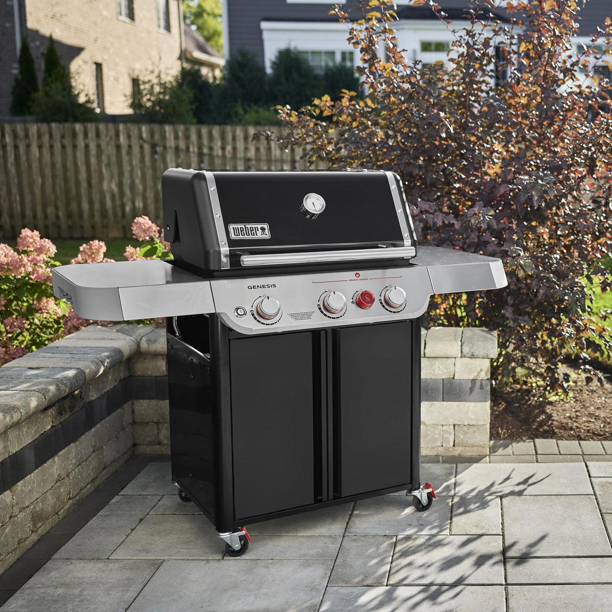 Grease management tray on the Weber Genesis E-325 simplifies post-cook cleanup.