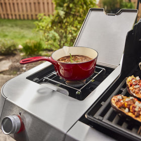 Weber Genesis E-335 porcelain-enameled cast-iron grates retain heat for searing.