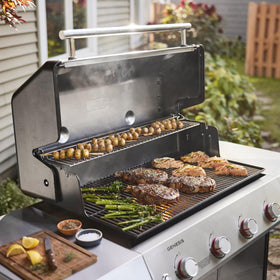 Weber Genesis S-415 side tables and large cooking surface support prep and multitasking.