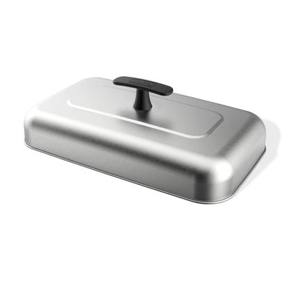Weber Griddle Extra-Large Basting Dome on stainless steel, melting cheese over burgers for even heat.