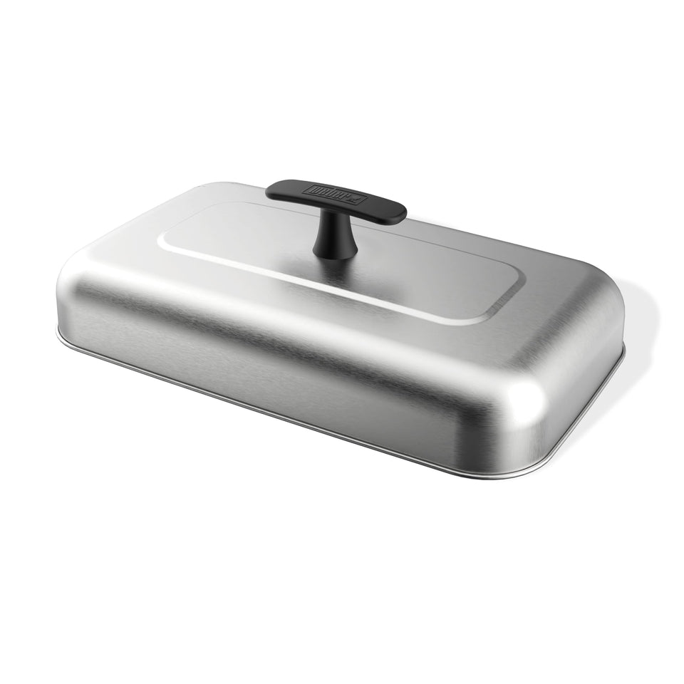 Weber Griddle Extra-Large Basting Dome on stainless steel, melting cheese over burgers for even heat.