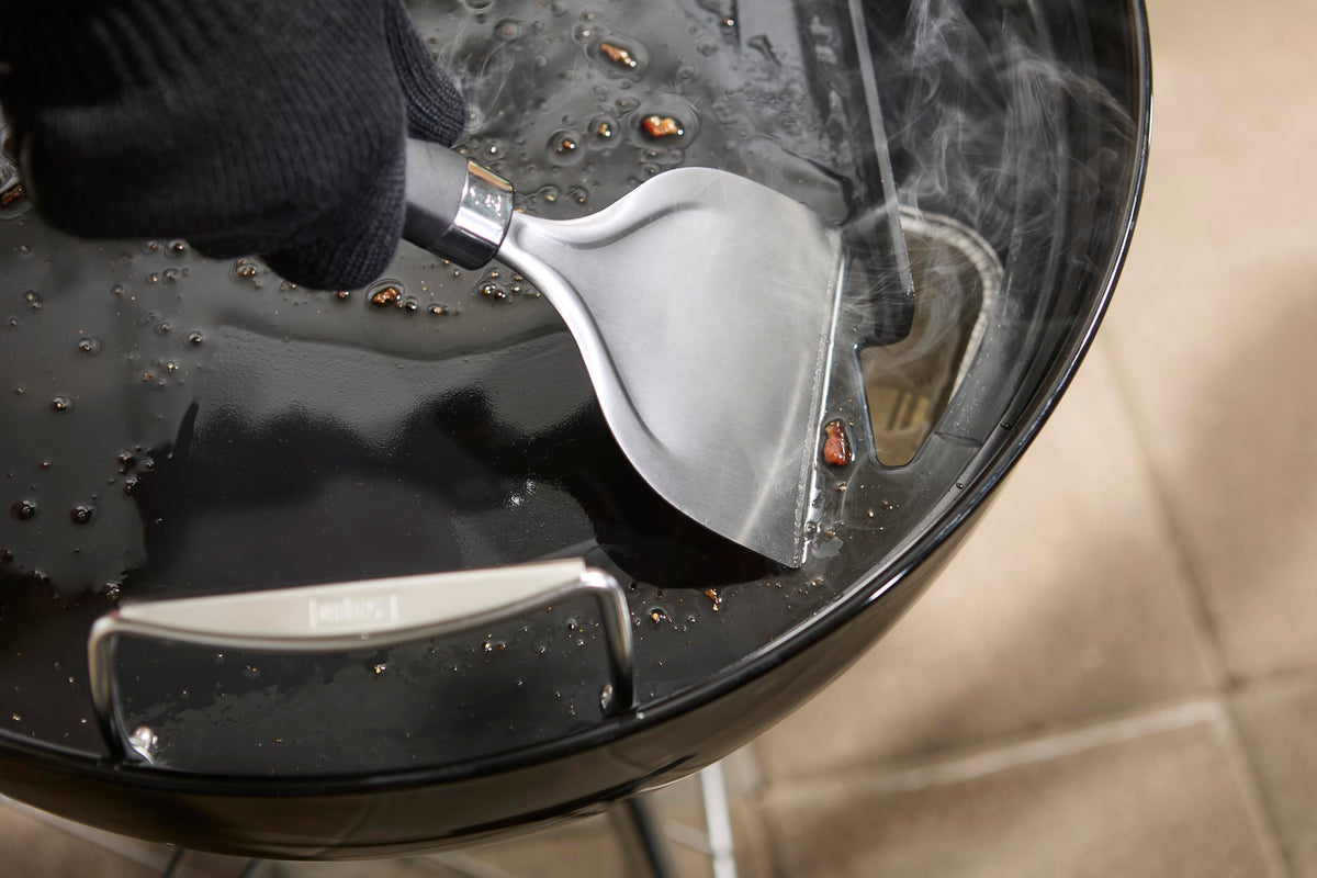 Weber griddle featuring rear grease slot and backstop for tidy grilling
