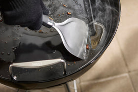 Weber griddle featuring rear grease slot and backstop for tidy grilling