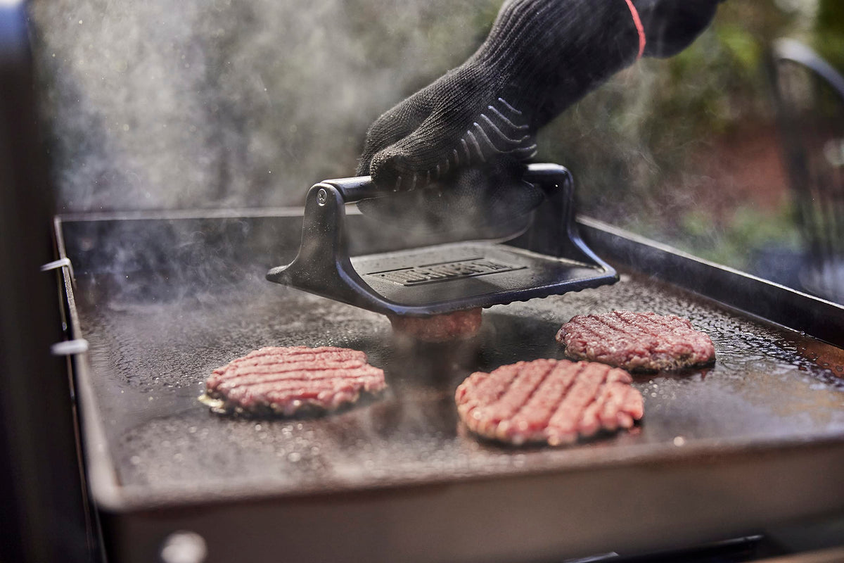 Weber Griddle Press textured surface releases food easily on the grill.