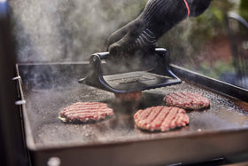 Weber Griddle Press textured surface releases food easily on the grill.