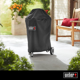 Weber grill cover with Velcro straps provides a secure, snug fit.