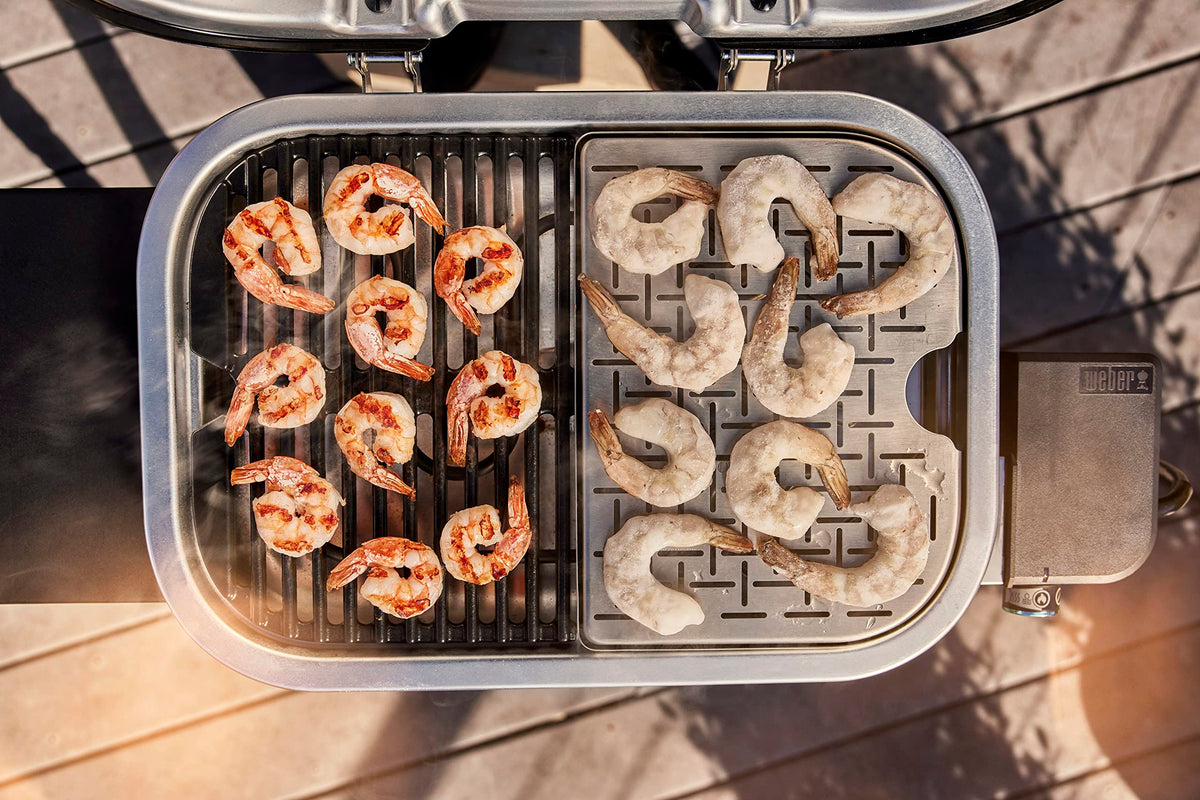 Weber Lumin Compact grill black finish blends with outdoor décor.