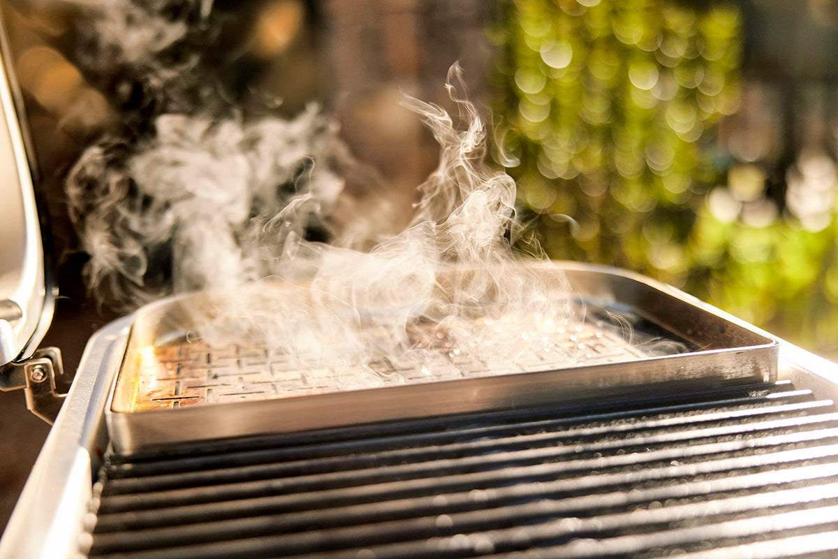 Weber Lumin Compact grill front grease tray simplifies cleanup after grilling.