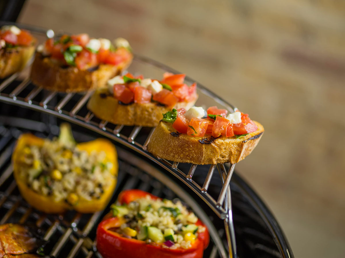 Weber Master-Touch 22-inch warming rack in use for buns and sides