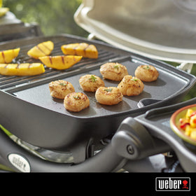Weber Q Griddle features a no-spill rim to keep drips contained.
