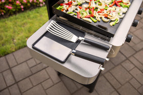 Weber Side Table Tool Rest raised edges contain grease and debris.