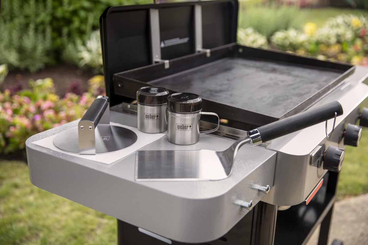 Weber wide spatula slides under burgers for safe flipping