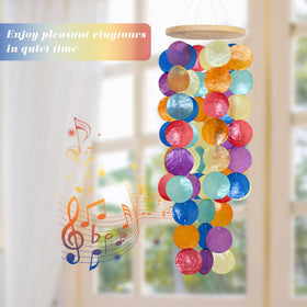 WeDoSoy rainbow-capiz wind chime highlights sunlight with shimmering reflections.