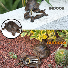 Close-up of cast iron turtle showing durable, weather-resistant key storage outdoors.