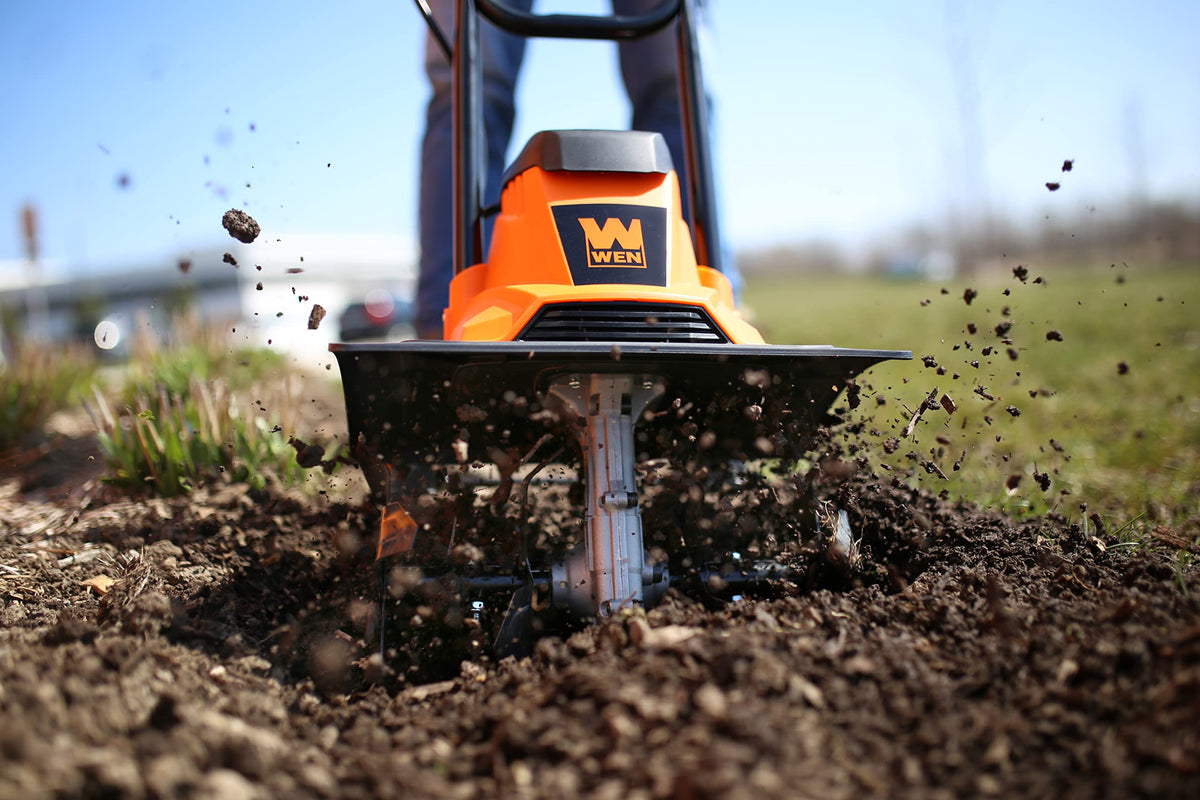 WEN tiller with 10 amp motor powering deep soil turning