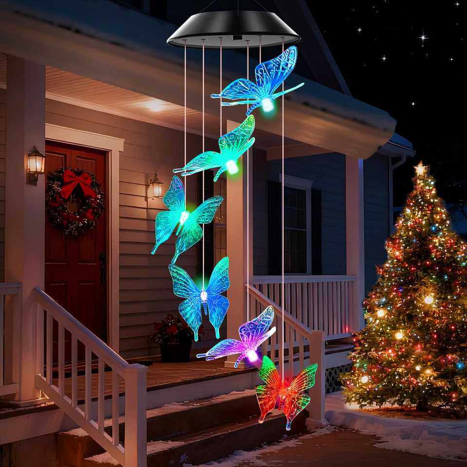 WENANA blue butterfly solar wind chimes glow with color-changing lights at night.