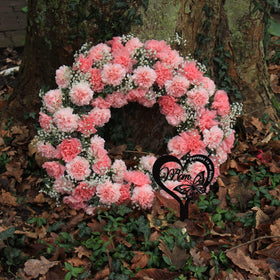 Wesiti garden display in yard demonstrates durable grave stake resilience.