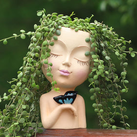 WEWEOW face planter outdoors adds whimsy to outdoor spaces.